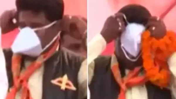 N95 मास्क लगाने की कोशिश करता रहा नेता 