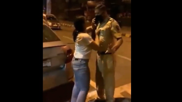 बीच सड़क पुलिस अधिकारी को कॉलर पकड़कर धमकाया
