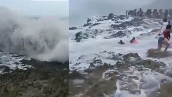 बीच पर मस्ती कर रहे लोगों को ले बही लहर बीच पर मस्ती कर रहे लोगों को ले बही लहर