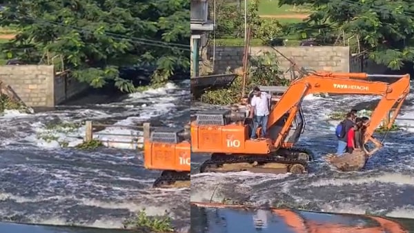 क्रेन में खड़े होकर ऑफिस पहुंच रहे लोग क्रेन में खड़े होकर ऑफिस पहुंच रहे लोग