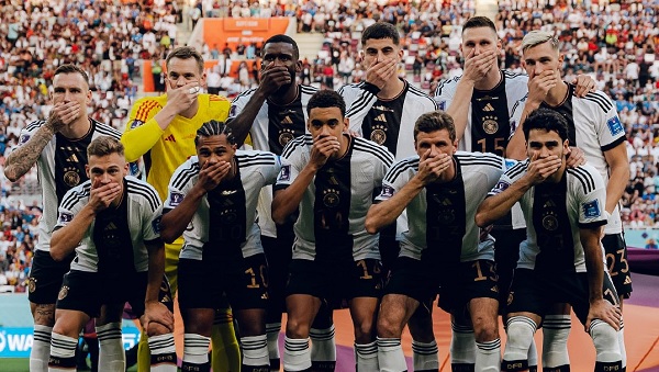 German players put their hands on their mouths German players put their hands on their mouths