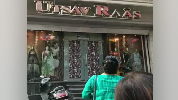 The woman set the sari on fire outside the showroom