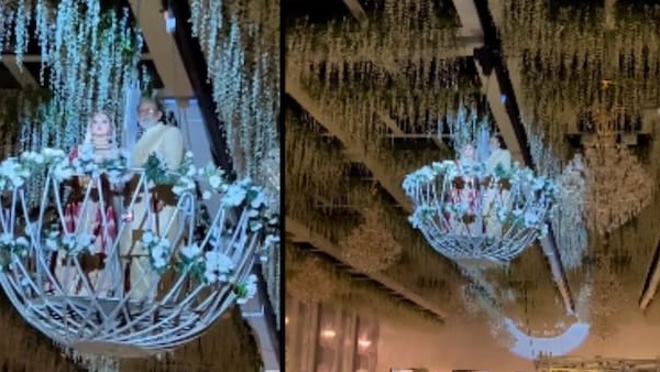 छत पर लगे झूमर पर पिता के साथ दुल्‍हन ने की एंट्री 