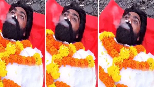 सिगरेट के कश लगा रहा शख्स