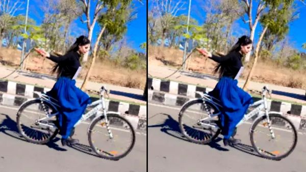 साइकिल चलाते हुए स्किप कर रही लड़की