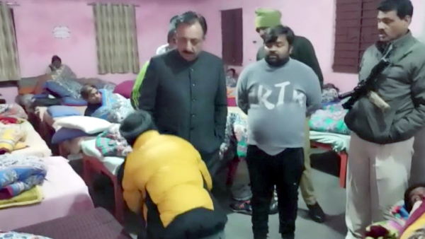Saharanpur on duty tax collector caught drinking liquor with junior by MLA toching feet apologising Saharanpur on duty tax collector caught drinking liquor with junior by MLA toching feet apologising