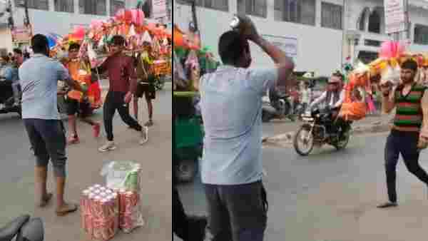 कांवड़ियों को शख्स दे रहा है बीयर
