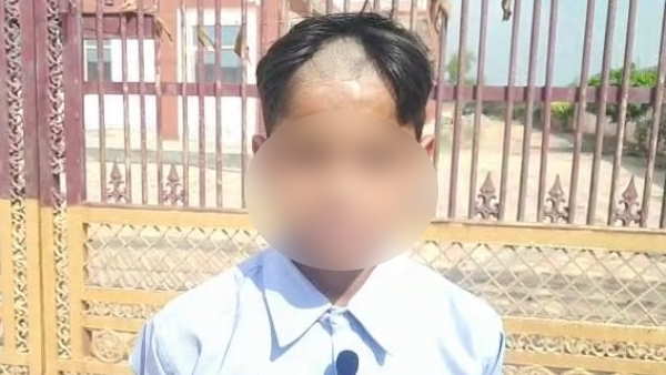 hair trimmed by teachers of a student for not paying school fees of 2 months in Baghpat