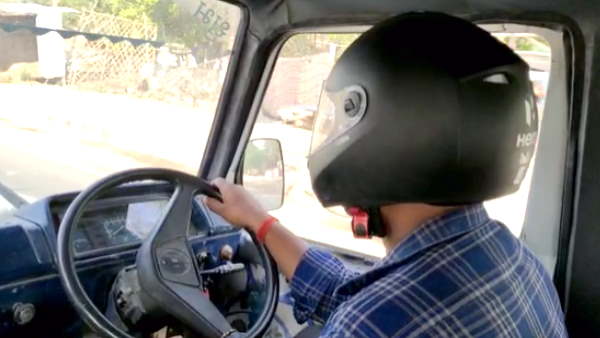 Hamirpur the four wheeler driver challaned for not wearing helmet now driver wearing while driving