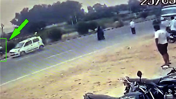 Amroha Road Accident Live CCTV Video child crossing road hit by car fell 15 feet away Death on spot