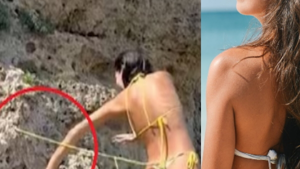 Woman bikini stuck with rocks 