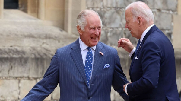  Biden puts his hand on King Charles