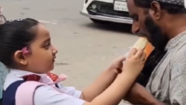 school girl giving her tiffin to beggar