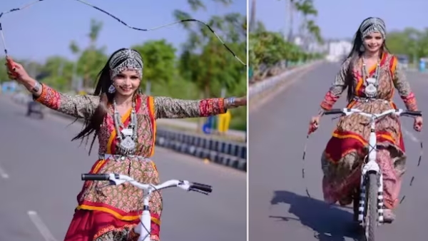 woman ride bicycle with a rope