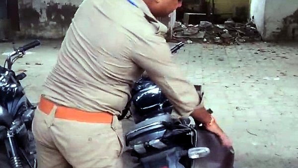monkey took out liquor bottle from the bike of a policeman in Kanpur Police Commissioner Office