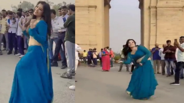 Woman dances Outside India Gate 