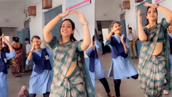 teacher dances with children