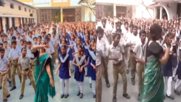 Teacher dances with students