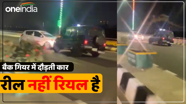 ghaziabad-when-faced-with-police-ran-away-with-car-in-back-gear-video-viral