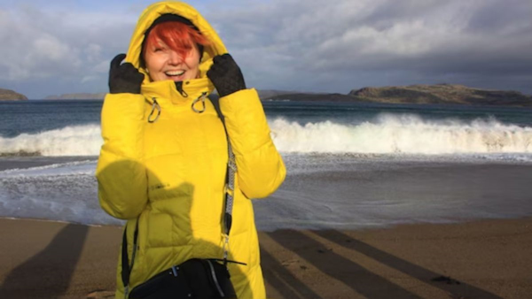 Wearing Yellow Jacket Against Blue Sky Wearing Yellow Jacket Against Blue Sky