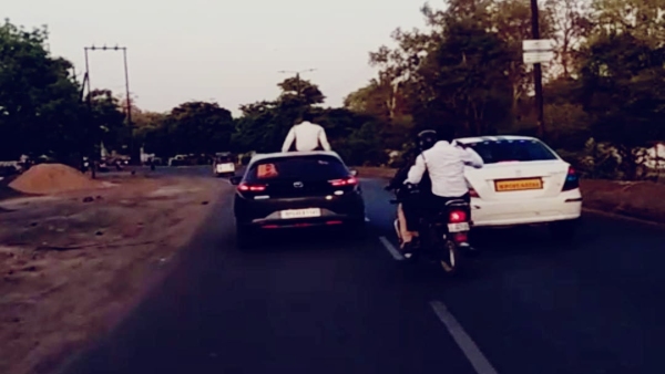 Traffic policeman hit video of constable sitting on roof of car goes viral Piplani incident