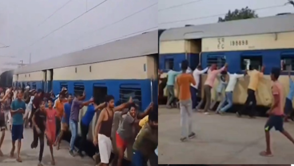 People push the train on tracks in Bihar
