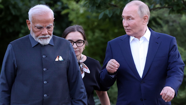 Lady with PM Modi and Putin in Russia