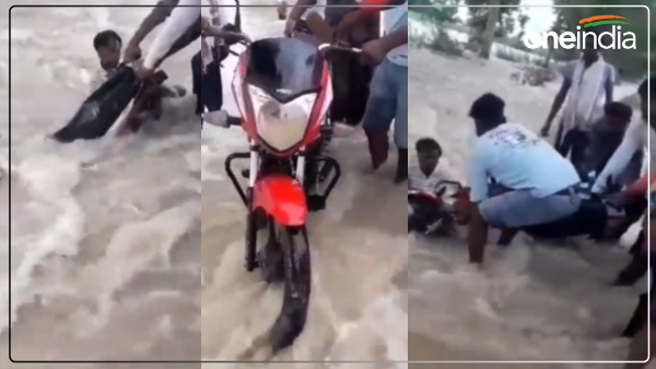 up-flood-news-bike-rider-started-flowing-in-flood-water
