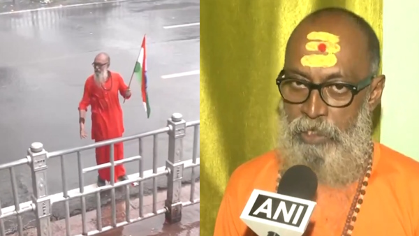 sadhu with tricolour in hand braving the barrage from water cannons targeted against protesters in Kolkata