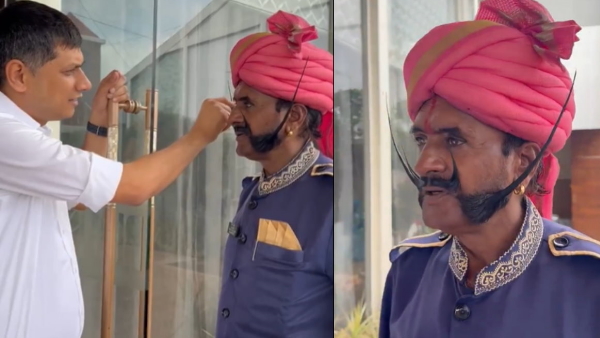 Guard takes care of his moustache