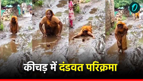 Woman prostrates on the muddy road of Sheopur