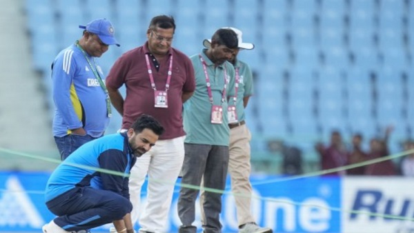 Zaheer Khan inspects the pitch