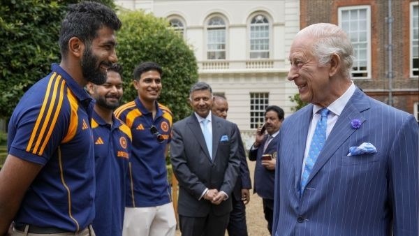 King Charles III interacts with Indian cricketer