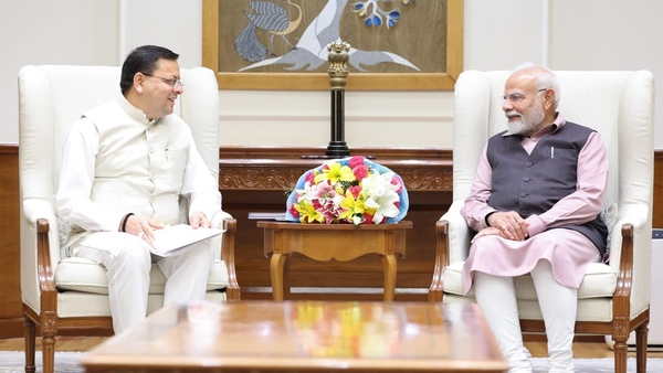 Dhami Seeks Guidance from PM Modi