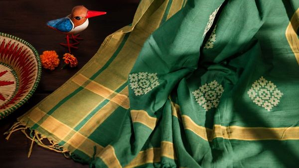 Artisan weaving traditional Bawan Buti saree fabric design