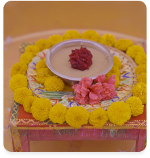 A puja platform ringed with marigold flowers