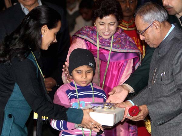 President receives gift from challenged boy 