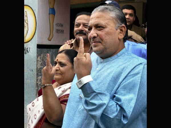 Narhari Amin and his wife show their marked fingers Narhari Amin and his wife show their marked fingers