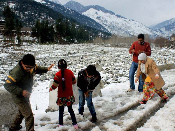 Playtime: Children play with snow