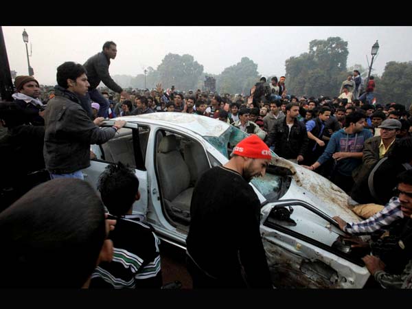 Protesters damage a government vehicle Protesters damage a government vehicle