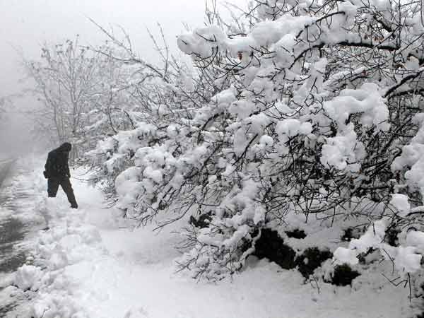 A man walks along the road