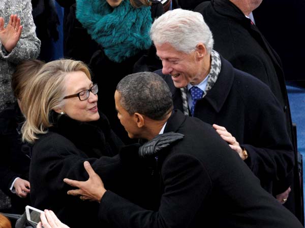 Barack Obama is greeted by Secretary of State Hillary Clinton