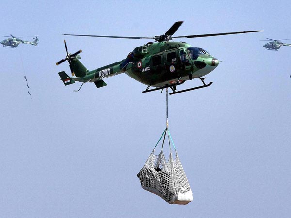 Defence personnel perform during the Aero India 2013 