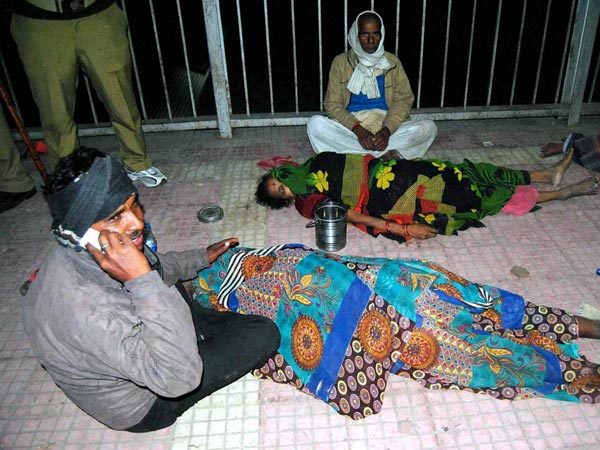 A man mourns the death of his relatives