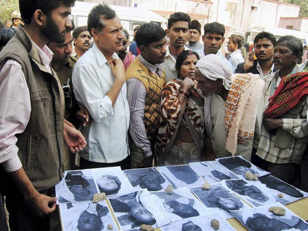 People viewing photographs of the dead
