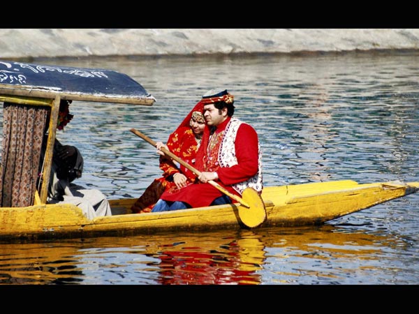A tourist couple posses for a photograph A tourist couple posses for a photograph