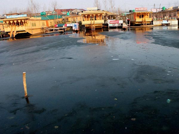 Houseboats seen at the frozen Dal Lake Houseboats seen at the frozen Dal Lake