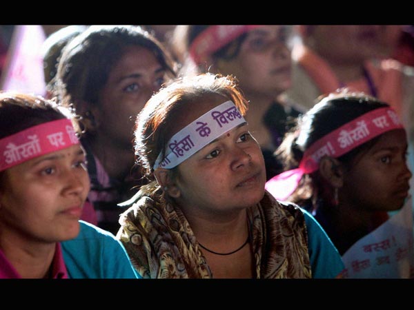 Women take part during a programme ‘One Billion Rising' campaign