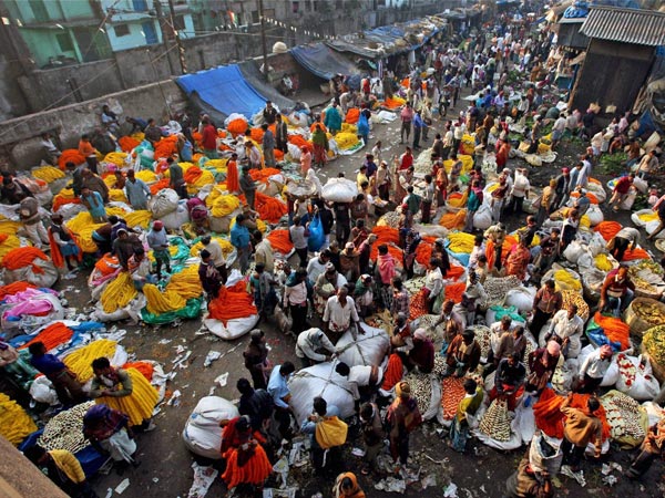 Traders gather at a flower market during first day