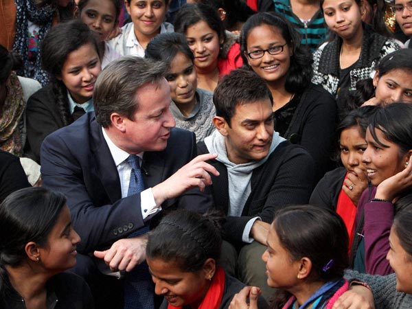 David Cameron and actor Aamir Khan with students